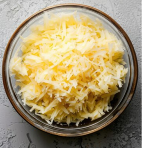 grated potatoes in water