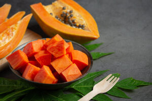 cutting papaya into cubes for shake